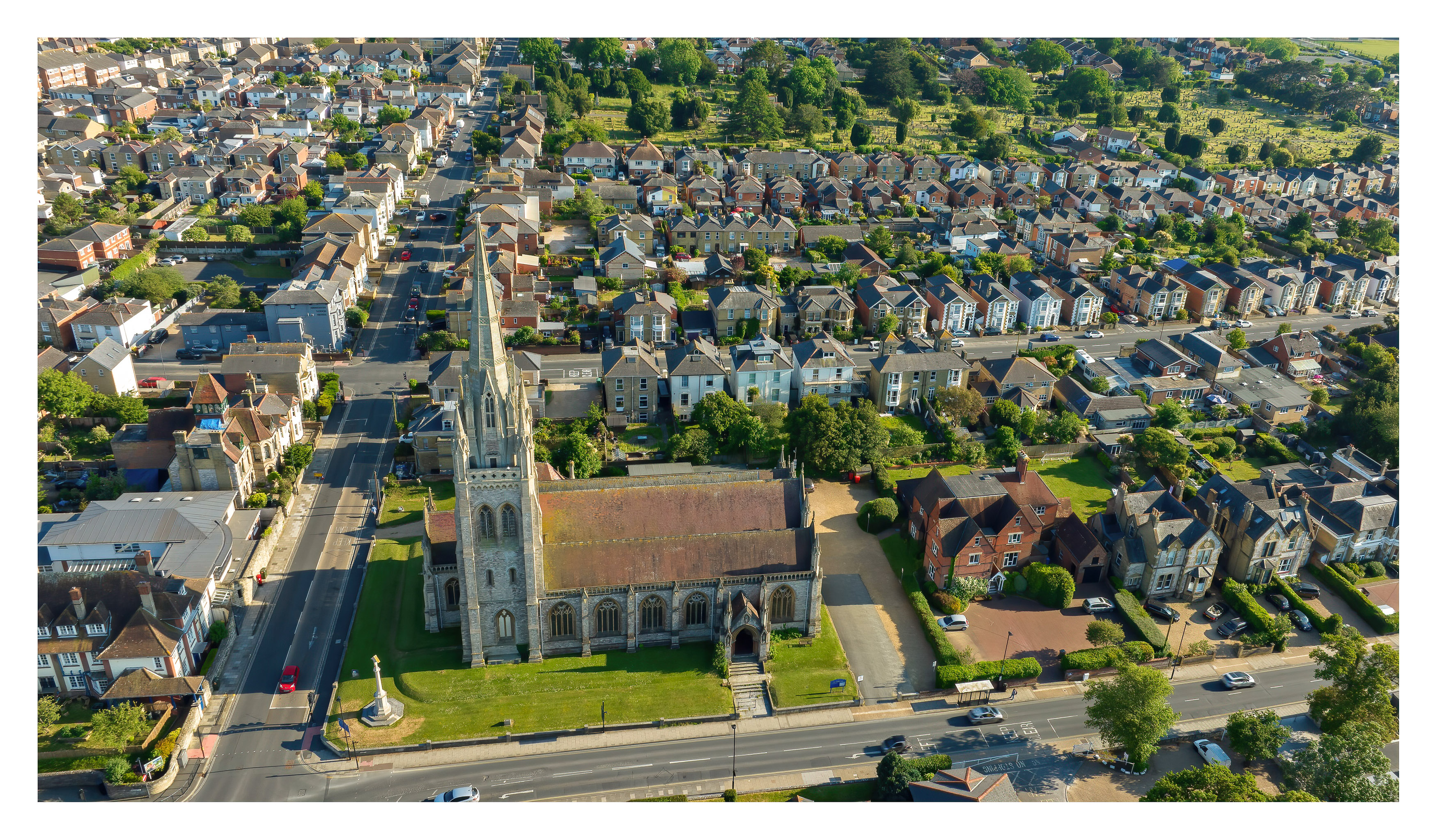 Church spire over neighbourhood aerial, Isle of Wight — destination photography by Samuel John Ford