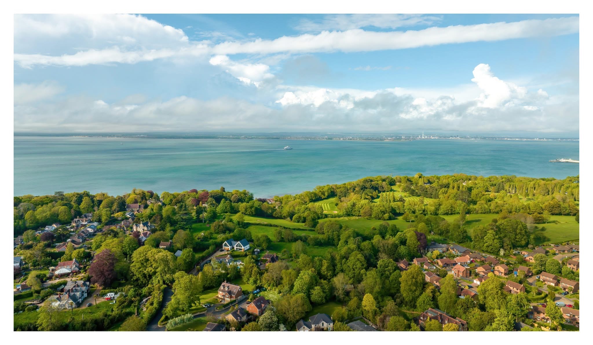 Coastal town on a bay, Isle of Wight — aerial destination photography by Samuel John Ford