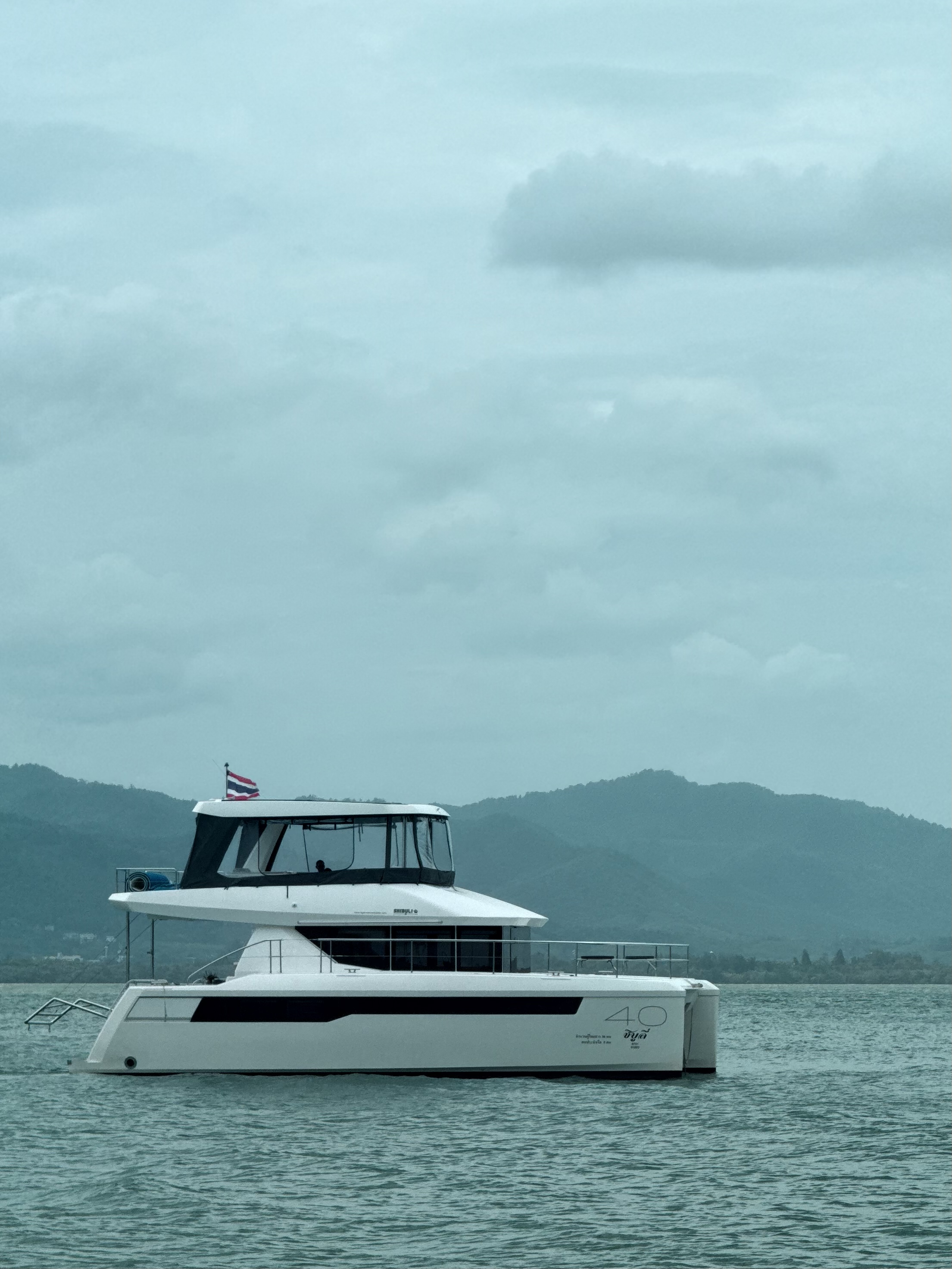 Catamaran on open water — travel photography by Samuel John Ford