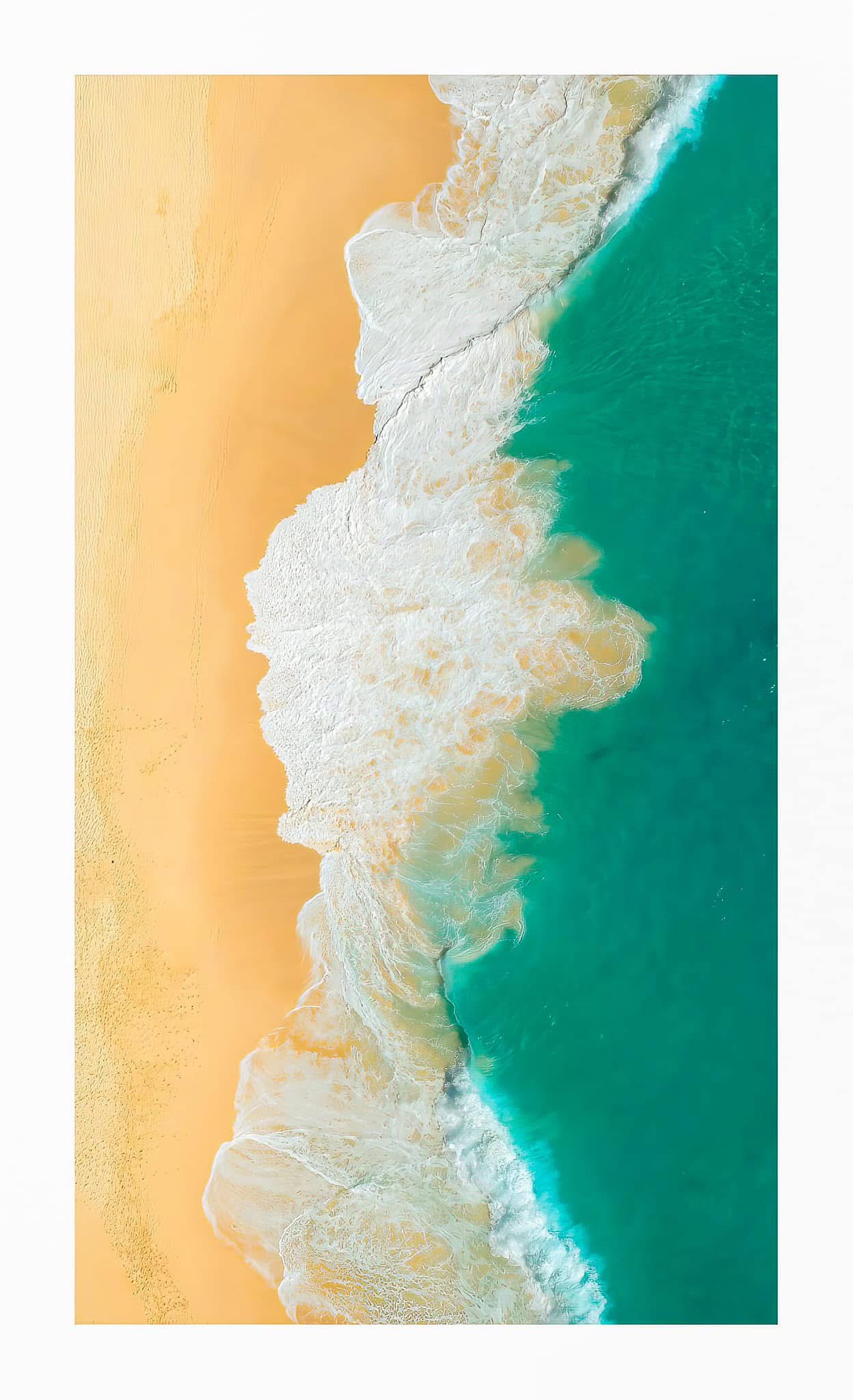 Top-down sand and surf abstract — travel photography by Samuel John Ford